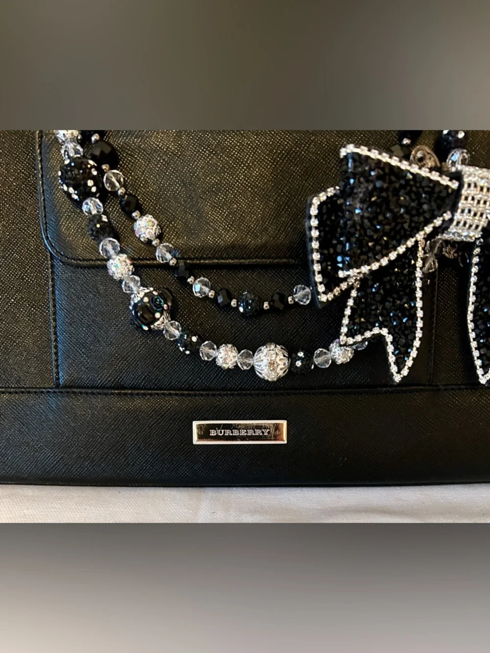 Burberry Saffiano Ceremonial Bag
Black Leather. Handmade Purse Charm included. - Picture 2 of 13